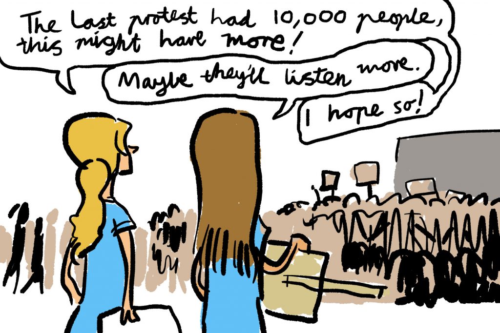 Drawing of two girls talking: "The last protest have 10,000 people, this might have more!" "Maybe they'll listen more." "I hope so!"